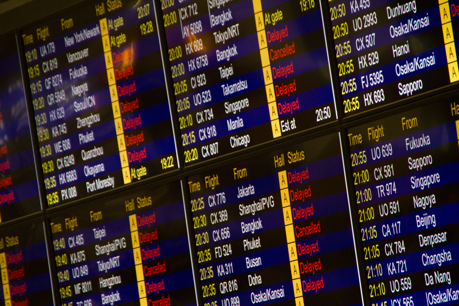 Airport departures board showing flight times